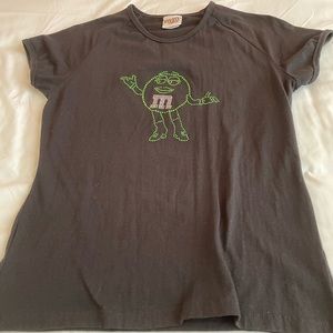 Green girl M&M shirt. Black. Size L